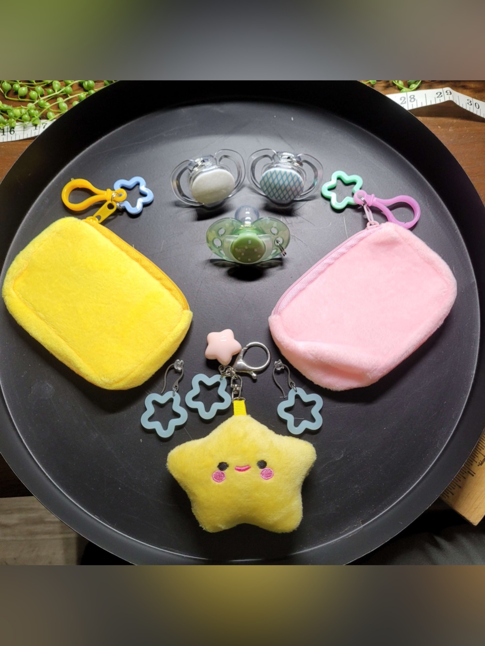 Rave festival earrings & bags, binkies, plush bag charms.